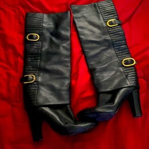 This are long black boots for made from Italy